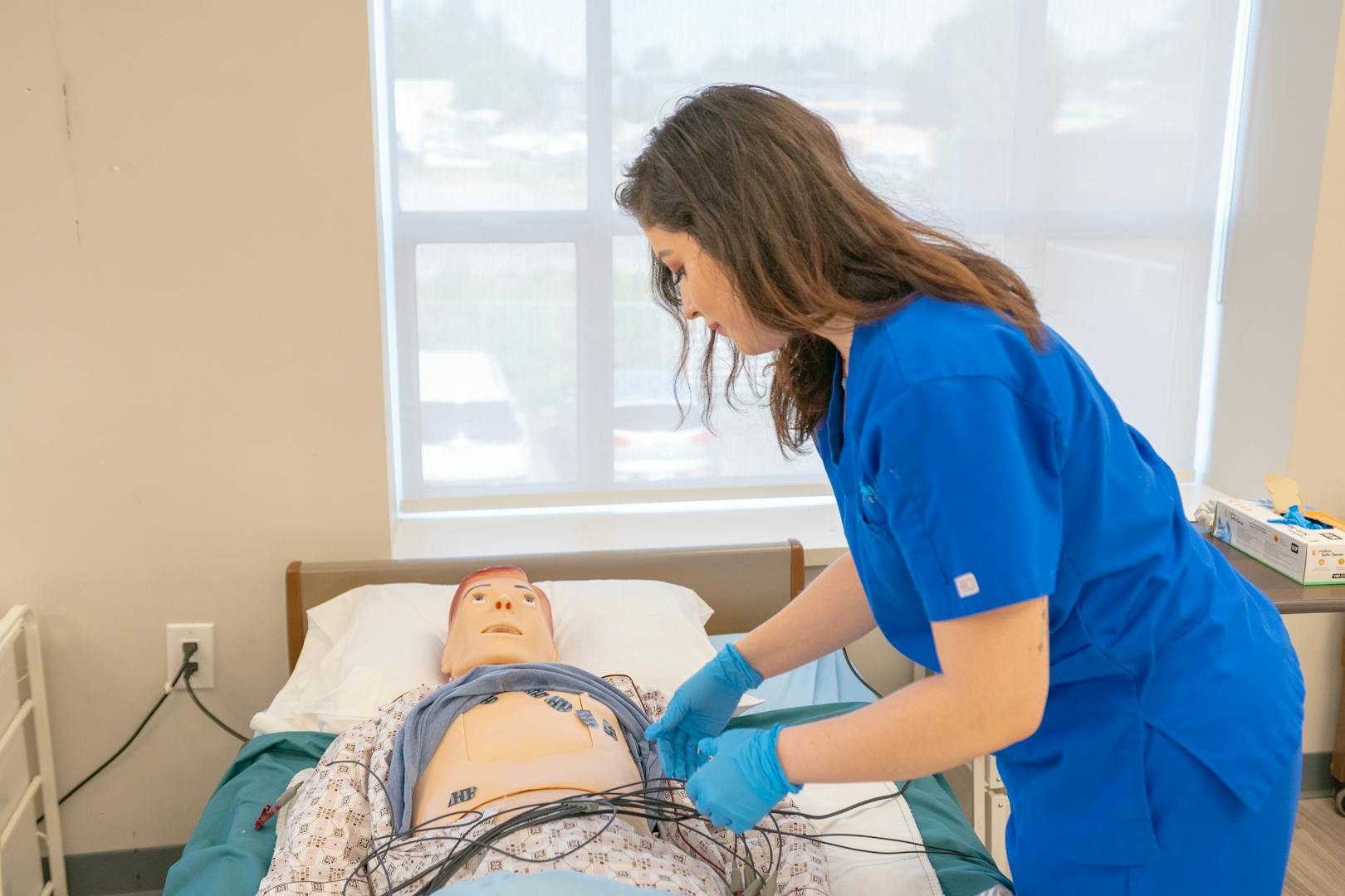 Learner practicing care procedures during a supervised placement